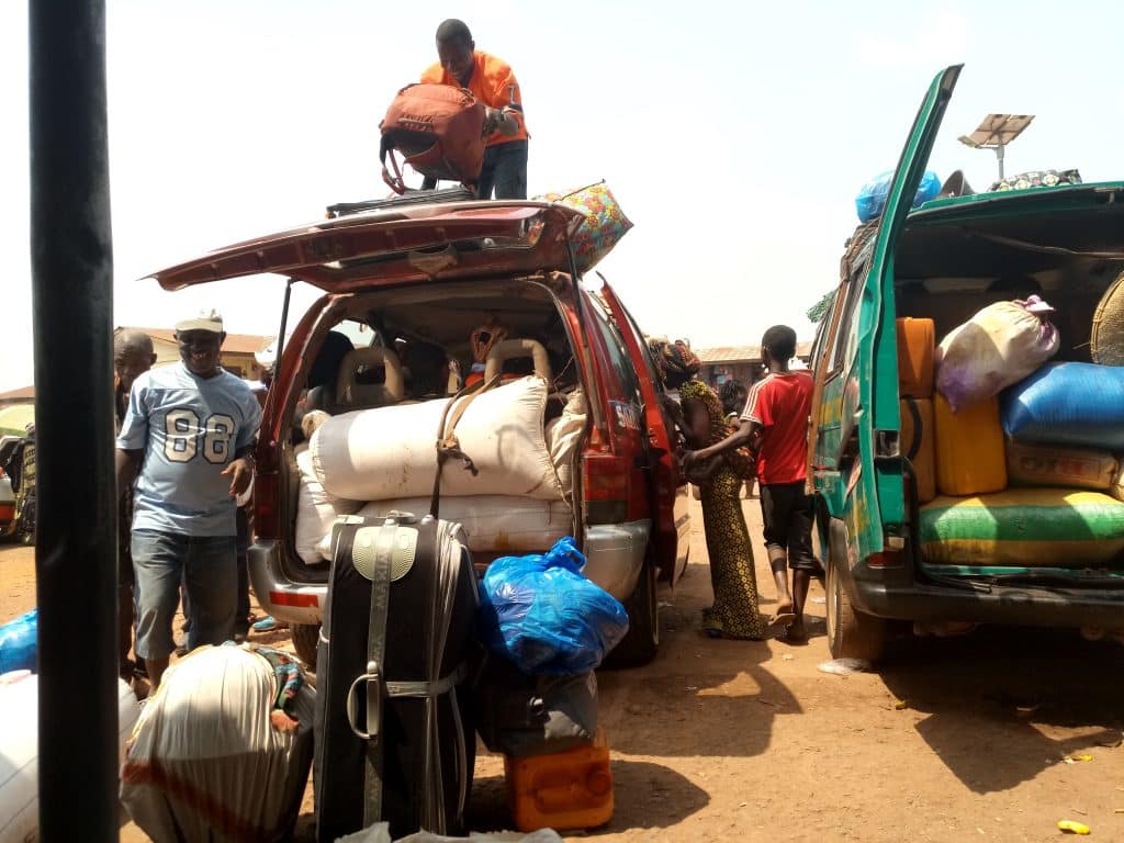 My backpack being loaded on the roof of a shared taxi in Makeni, Sierra Leone