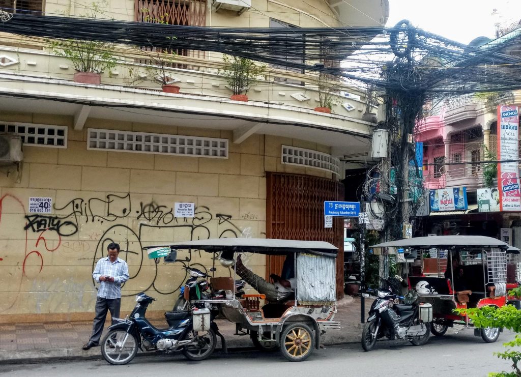 Tuk tuk drivers waiting for fares in Phnom Penh