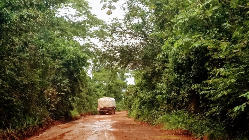 Truck on muddy dirt road in Liberia