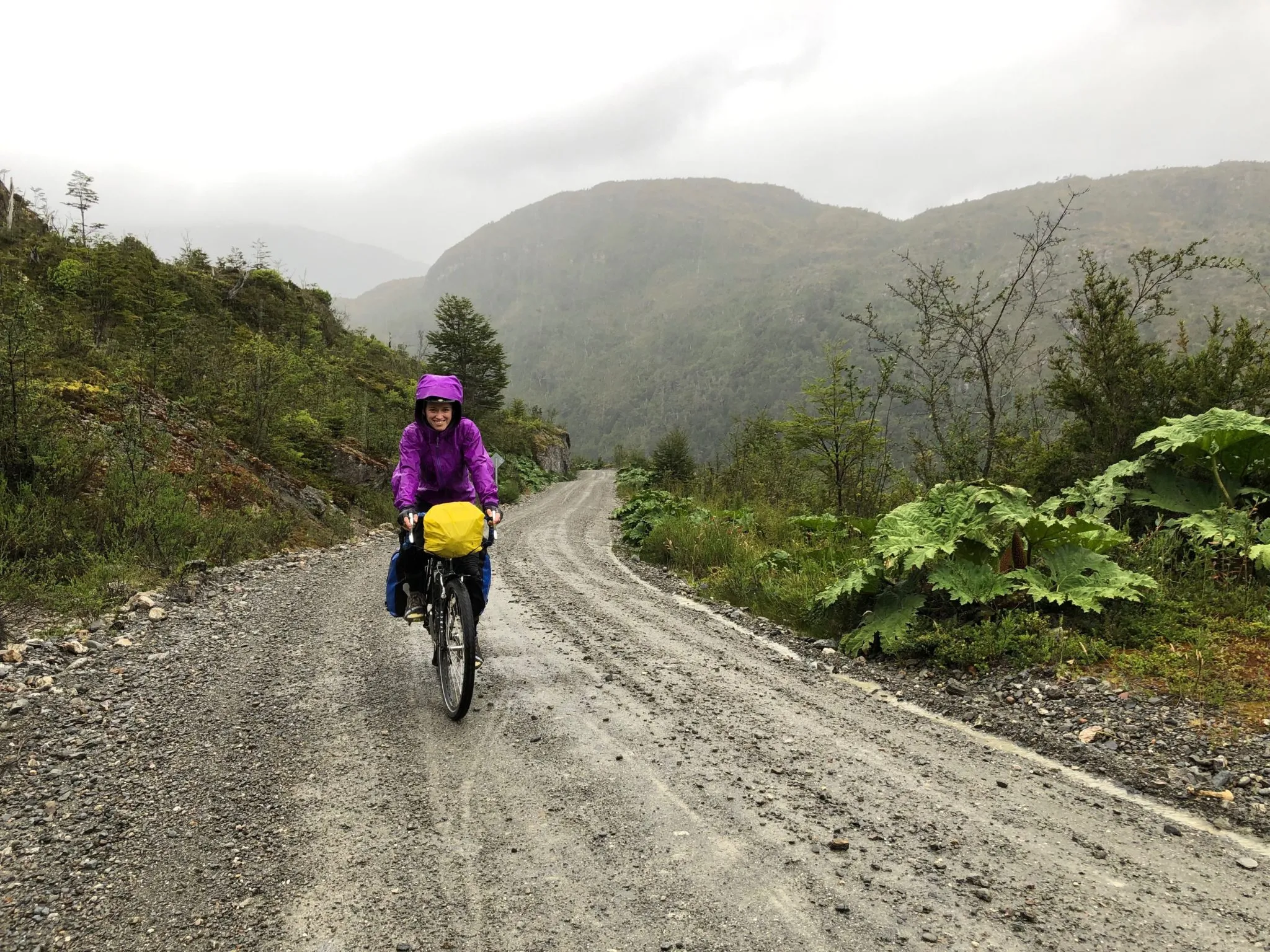 Cyclist riding in rain on Carretera Austral.