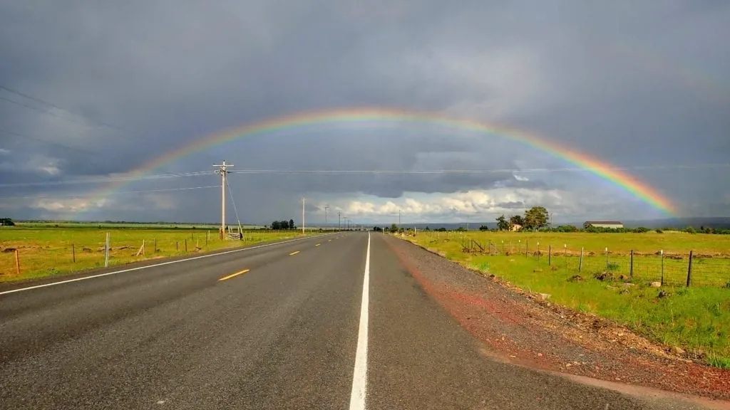 Rainbow over country road in Oregon