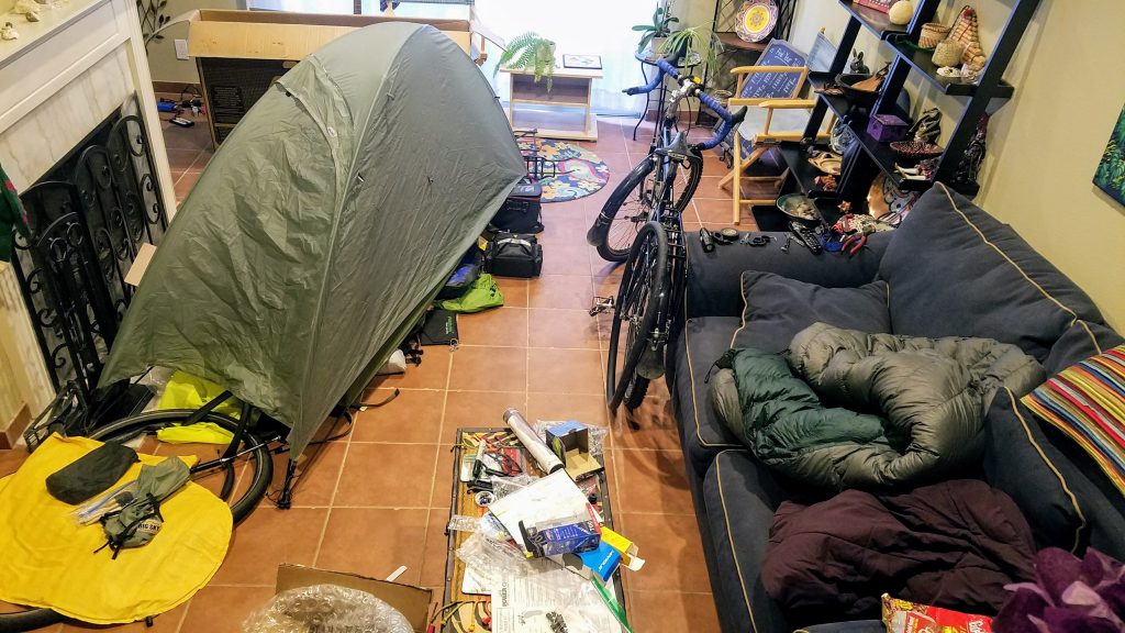 Living room full of outdoor gear