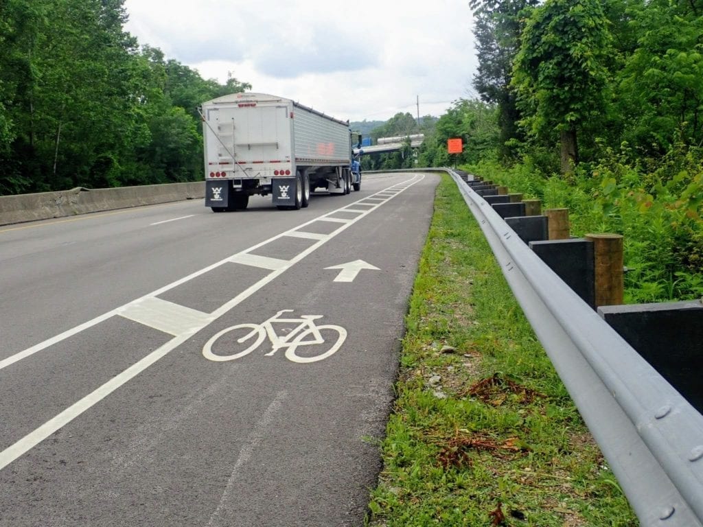 Bicycle lane with trucks passing