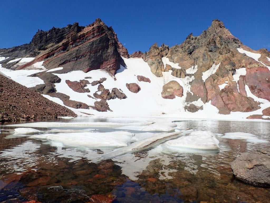 Alpine lake with floating ice