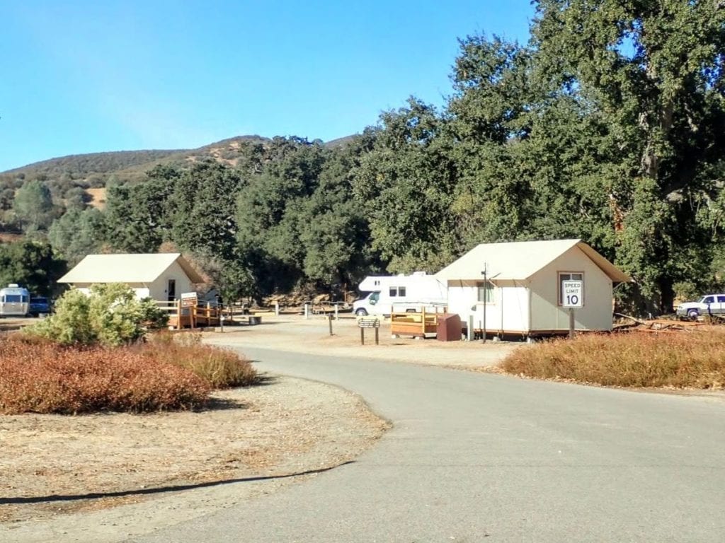 White tent cabins at campground