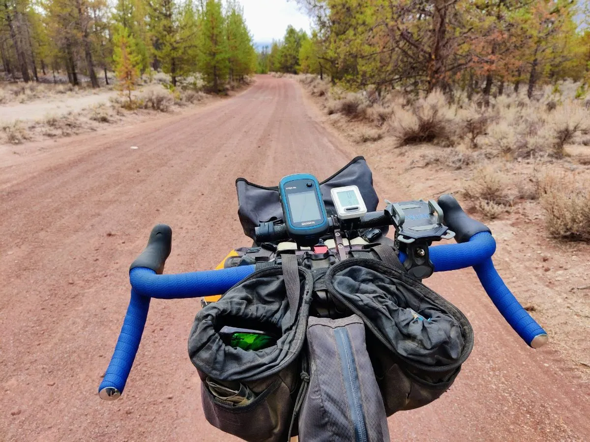 Coast handlebars pointing down red dirt road in central Oregon