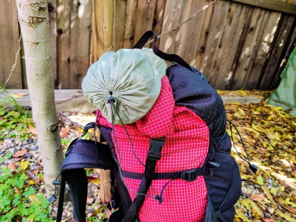 Strapping tent to clearance backpack