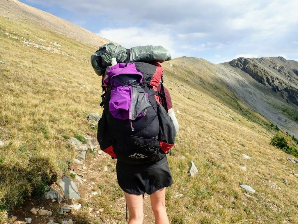 https://exploringwild.com/wp-content/uploads/2022/05/tent-on-backpack-Colorado-Trail-1024x768.jpg