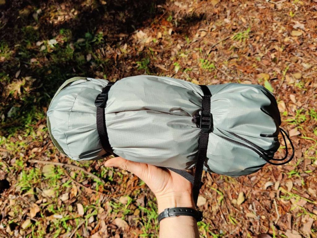 Big Sky Soul 1p bikepacking tent held in hand, showing how the short 12 inch poles make this tent more compact