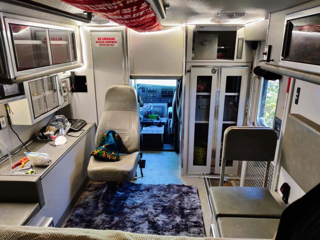 https://exploringwild.com/wp-content/uploads/2023/10/led-string-light-in-ambulance-camper-conversion-interior-1024x768.jpg